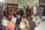The children and the volunteers of the Center attend the presentation regarding dental care 